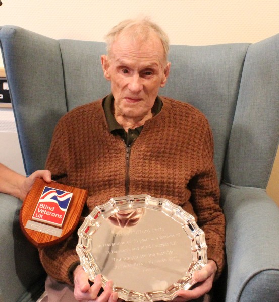 Norman Perry with his plaque and silver salver