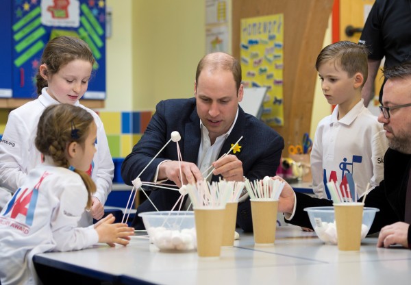 The Duke of Cambridge helps to build a freestanding tower from marshmallows and straws, in the tower build challenge at the launch of the SkillForce Prince William Award today.