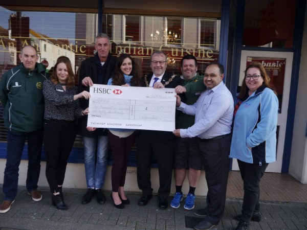 Image: Representatives from QAHH and WHCP receive cheque from Chippingdale Cricket Club at The Mahaan restaurant 