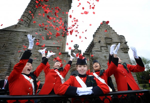 Irena Watson 12, Millie MacDonald 13, mirren wood 12 Simoon Pun 13, and Tiana Robbins 13 from Queen Victoria School Dunblane at the Wallace Monument today as 4600 petals from from the Crown.