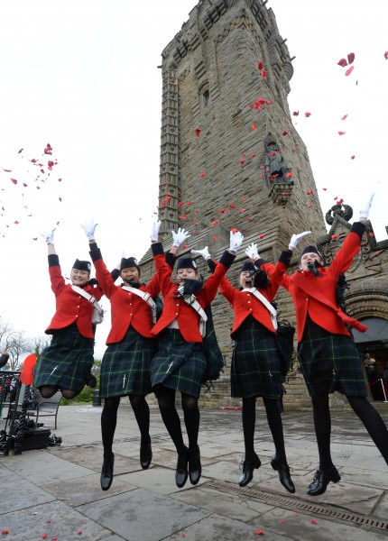 Irena Watson 12, Millie MacDonald 13, mirren wood 12 Simoon Pun 13, and Tiana Robbins 13 from Queen Victoria School Dunblane at the Wallace Monument today as 4600 petals from from the Crown.