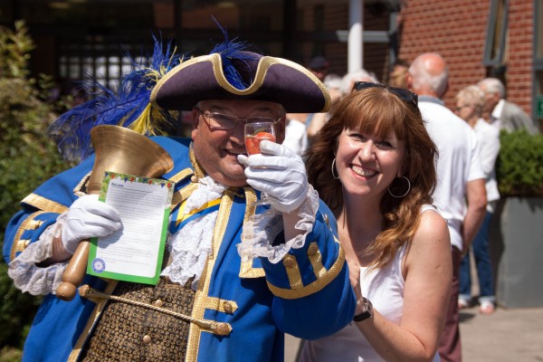 Worthing Town Crier, Bob Smytherman, with QAHH Head of Fundraising, Elizabeth Baxter (Credit: John Young Photography)