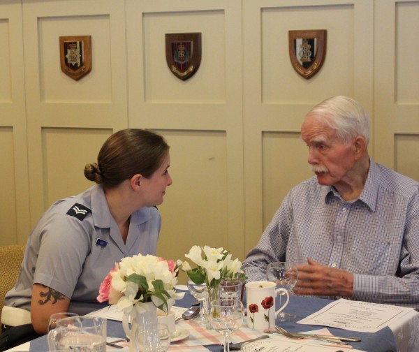 RAF Veteran Iain chatting over lunch with Corporal Way