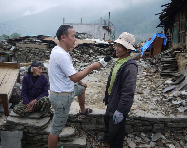 2. Principal Programmer (Brunei) Yograj Rai reporting in remote areas of Nepal after the 2015 earthquakes