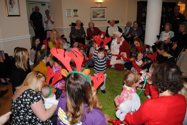 Residents and children join together in a festive sing-along