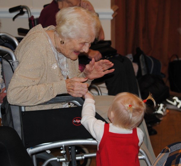 Resident, Vera, sharing a heart-warming moment with toddler