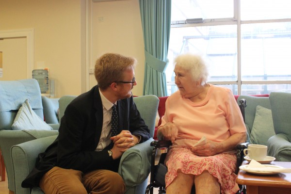 Lloyd Russell-Moyle speaking with blind veteran Fay Longman