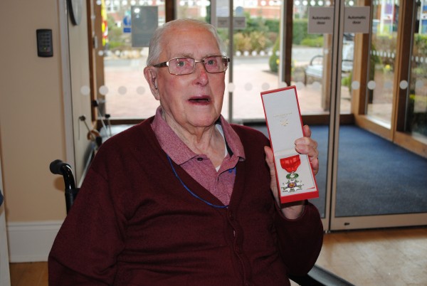 Arthur proudly holding his Legion d’honneur medal