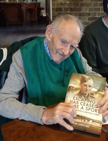 Frank Unwin holding his published novel.