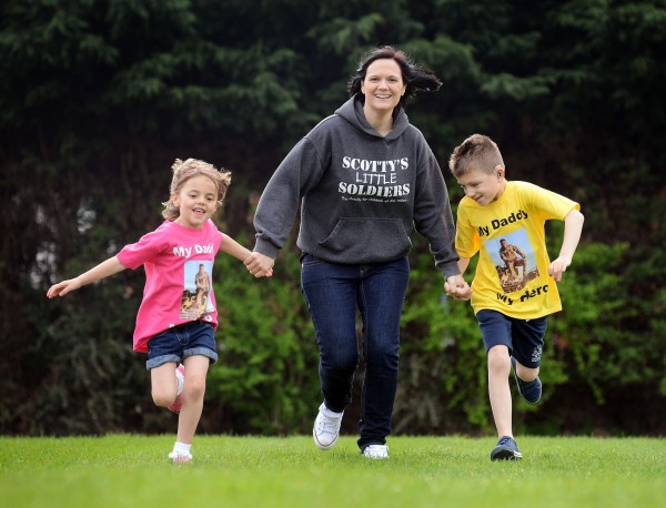 Nikki Scott of Scotty's Little Soldiers, with her children Kai and Brooke, who are running the Mini Gear 2014, in memory of their dad Cpl Lee Scott. Picture: Matthew Usher.
