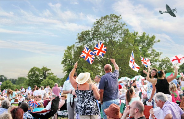 Battle Proms crowd with flags and Spitfire